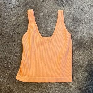 Buckle crop top, color peach, size small.